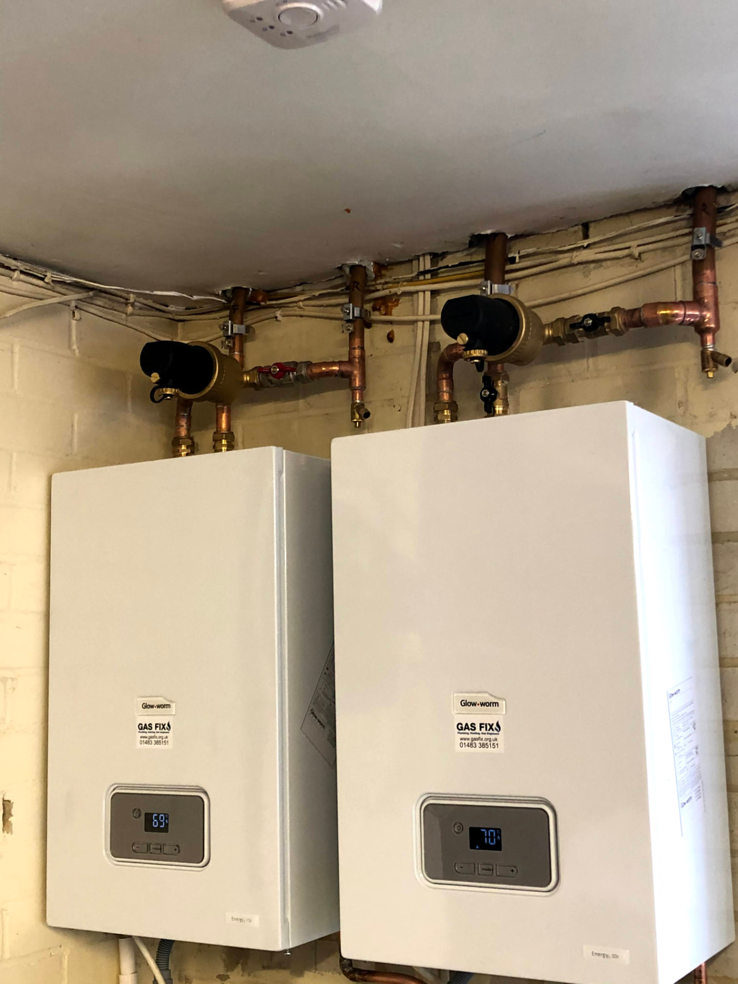 Two Glow-worm boilers installed on a commercial plant wall