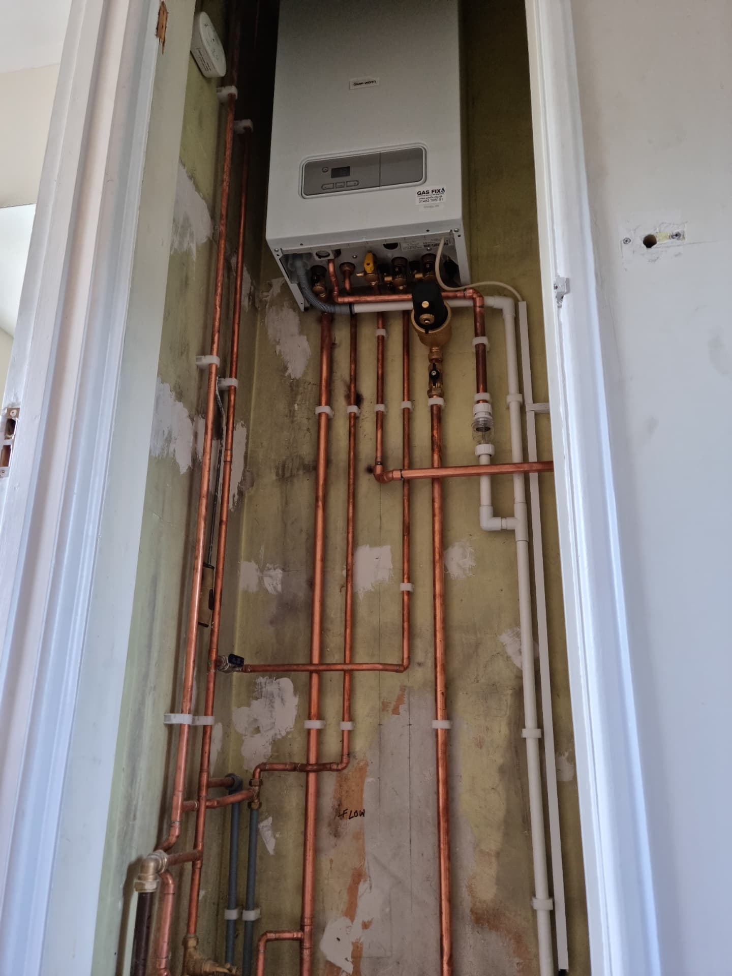 Glow-worm boiler with new copper pipework in a cupboard